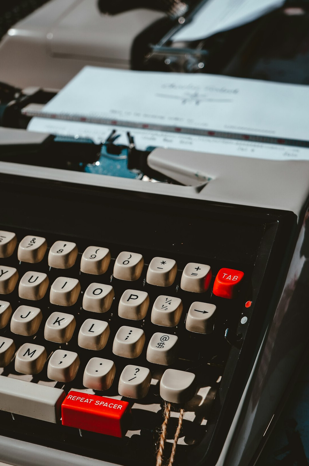 Journalist's desk with documents, an old typewriter and a cup of coffee